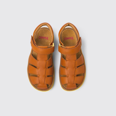 Overhead view of Bicho Brown leather sandals for kids