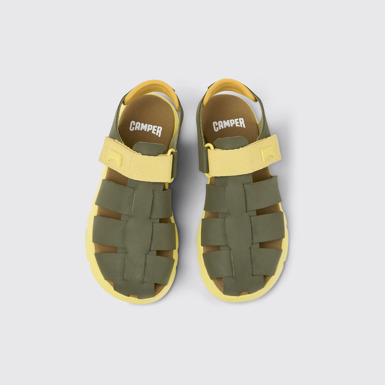 Overhead view of Oruga Green and yellow leather sandals for kids