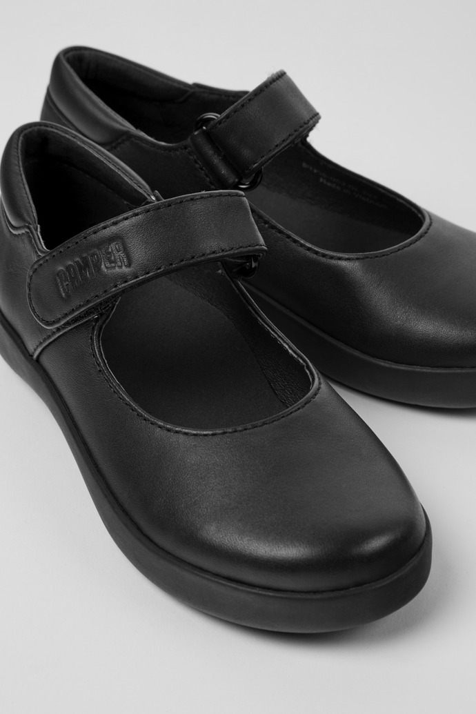 Close-up view of Spiral Comet Black Leather Shoes for Kids.